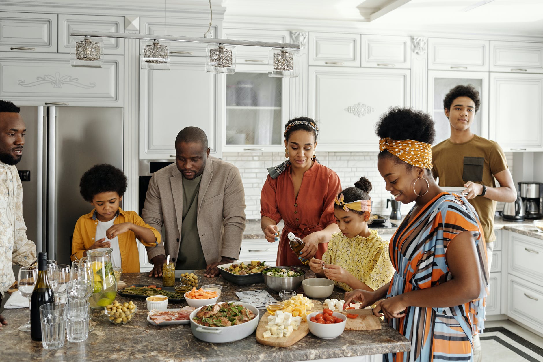 family preparing food in the kitchen