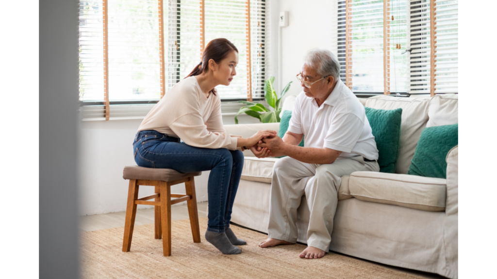 adult daughter discussing with aging father